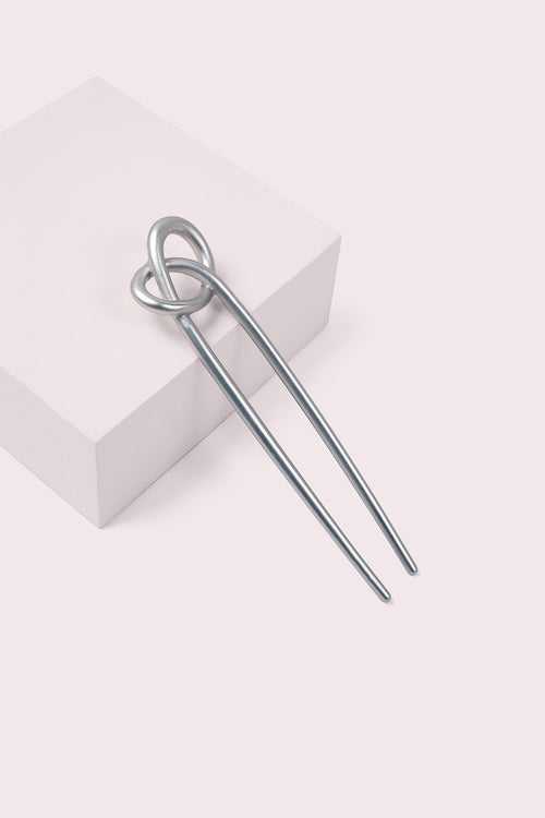 The Hair Edit Knotted Chignon Pin on pink box