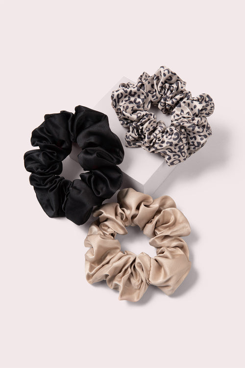 The Hair Edit Grand Ribbon Scrunchie Trio on pink box