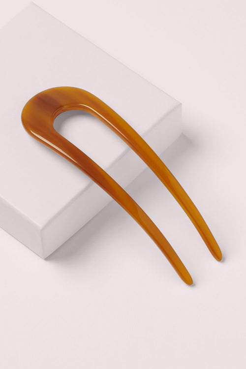 The hair edit jumbo chignon French hair pin on a pink box