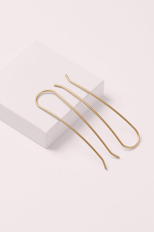 gold slim chignon French hair pin set on a white box