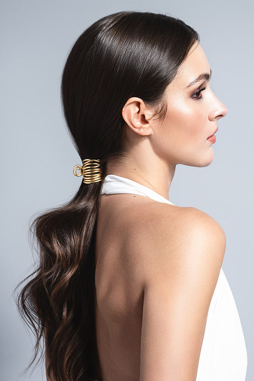 model with Gilded Wrap Cuff Claw Clip in her hair