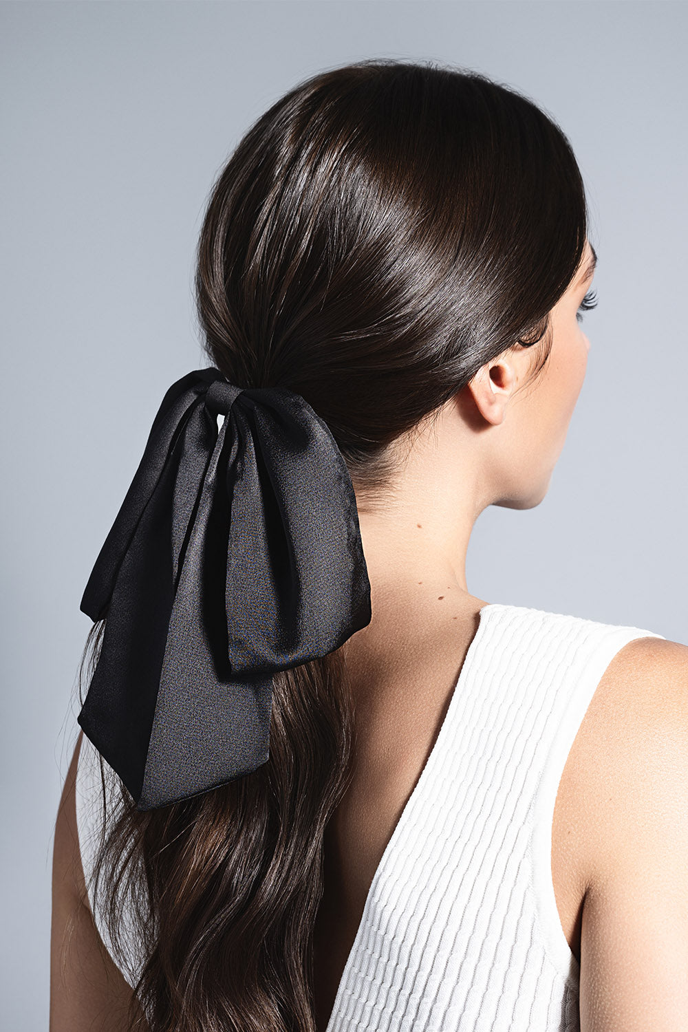 model with Runway Ribbon Satin Hair Bow in her hair