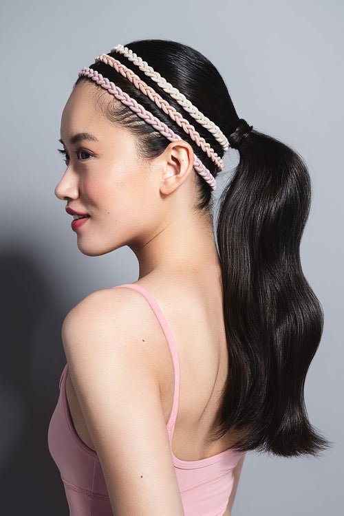 model wearing Salutation Slim Braided Headbands in her hair