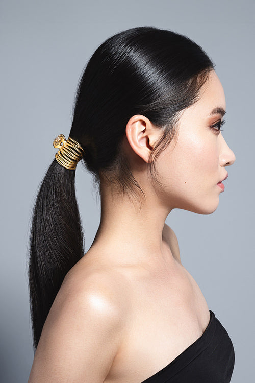 model with Gilded Wrap Cuff Claw Clip in her hair