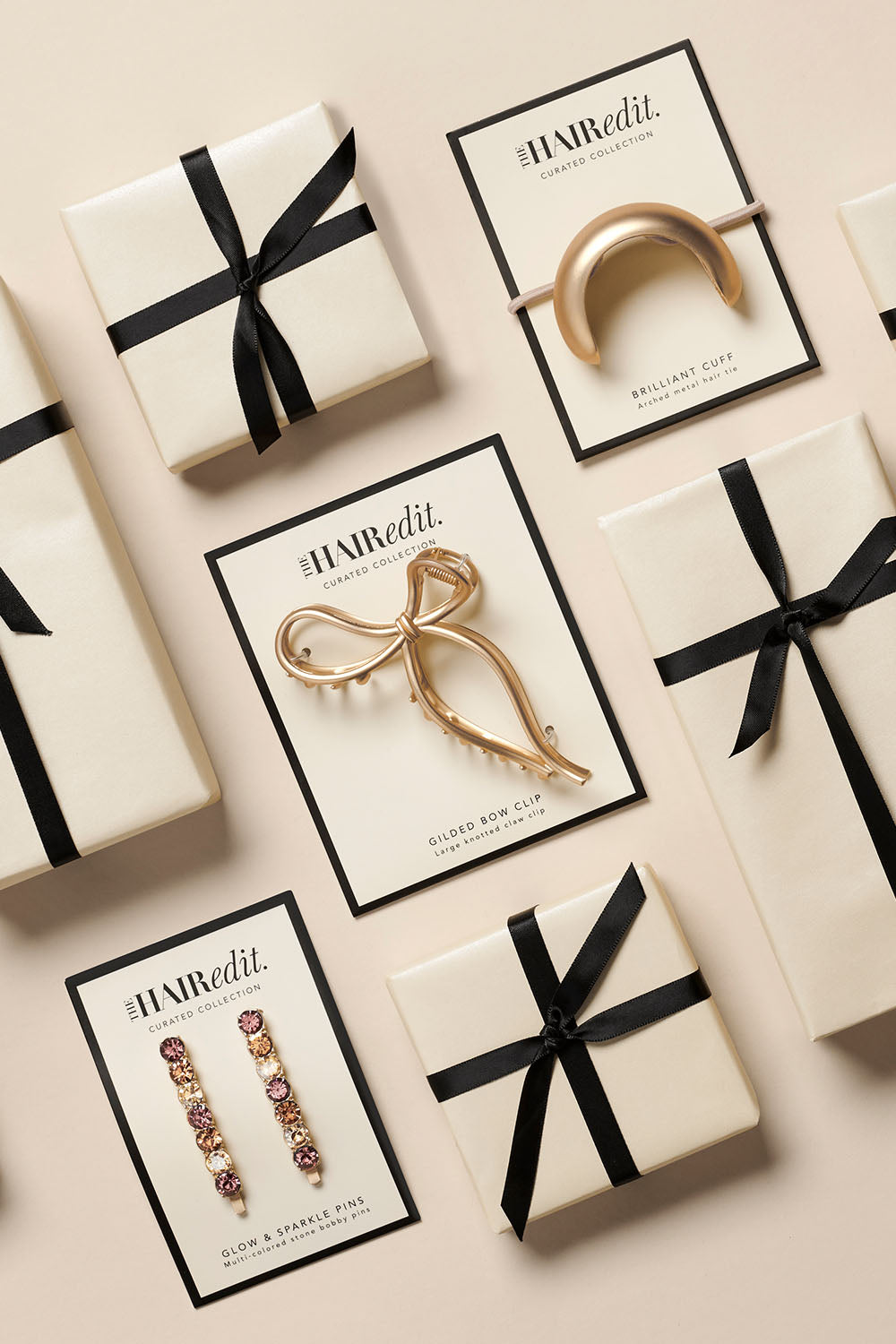 the hair edit holiday bundle with gilded bow claw clip brilliant cuff hair tie and glow on and sparkle bobby pins packaging