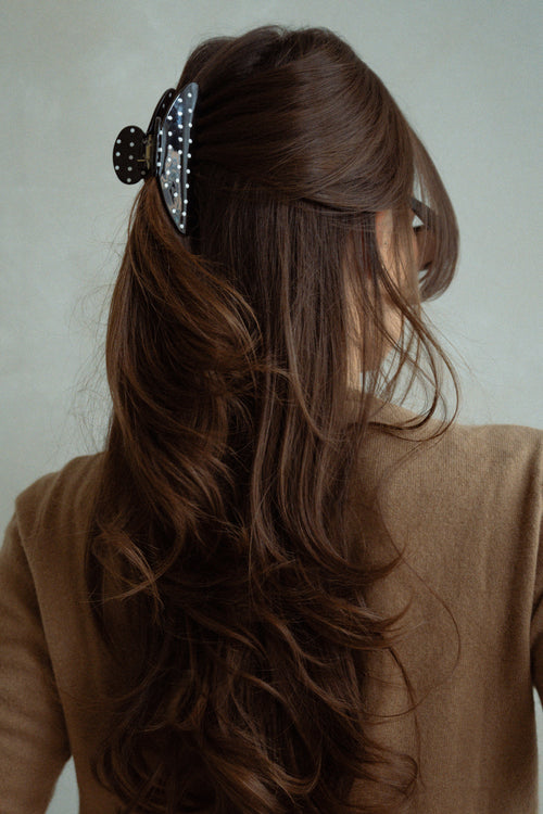 Danielle Bernstein wearing The Hair Edit’s black polka dot claw clip in her hair
