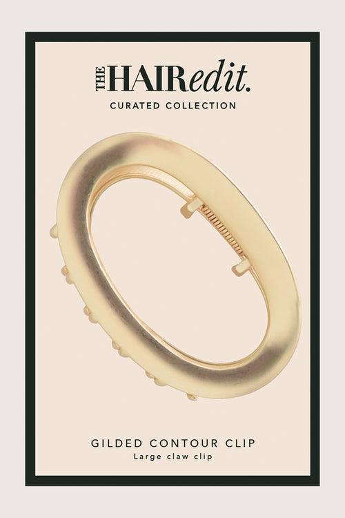 Gilded contour clip packaging on a beige background with 'The Hair Edit' branding.