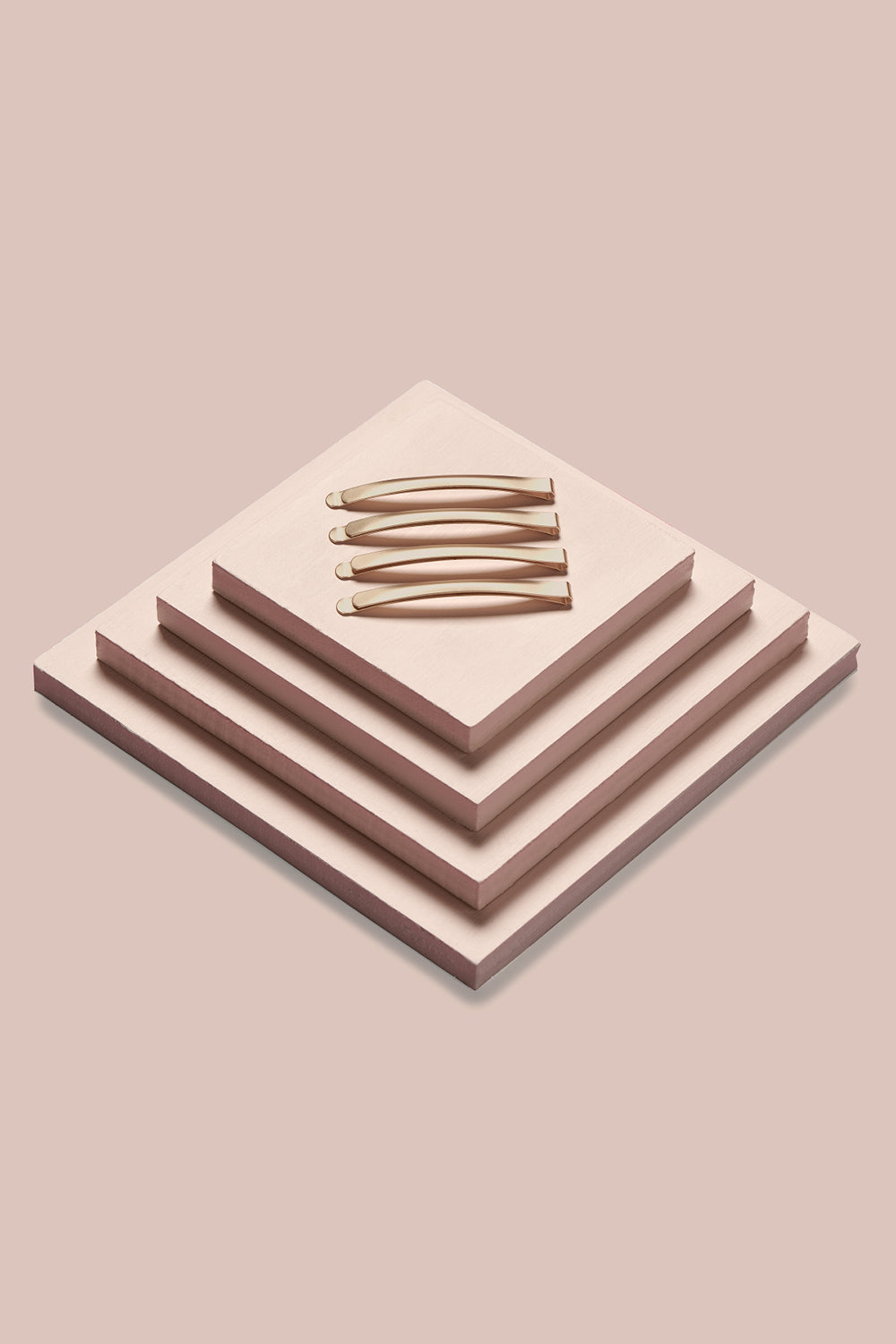 the hair edit bobby pins on a pink box