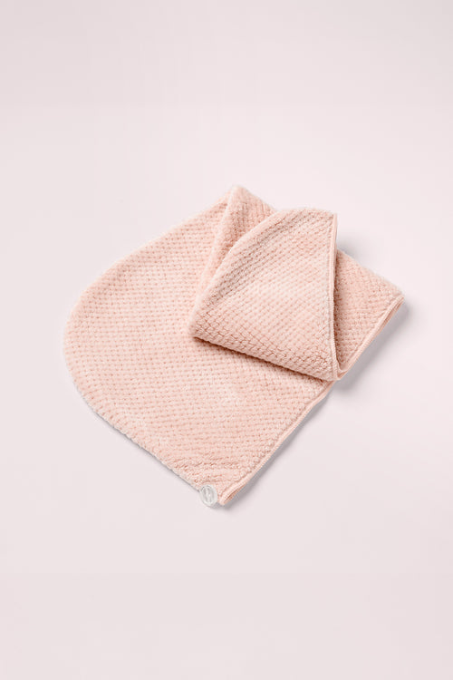 The Hair Edit Smooth & Dry Microfiber Hair Wrap on a pink background