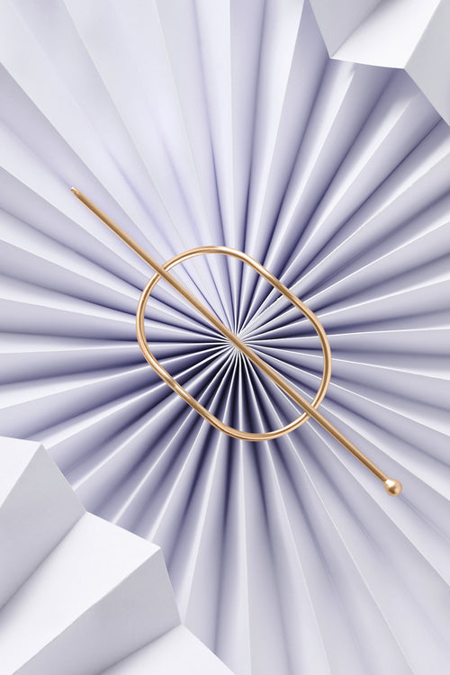 the hair edit hoop and pin gold on a blue crinkle design