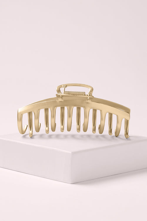 The Hair Edit Gilded Timeless Clip on a light pink background 