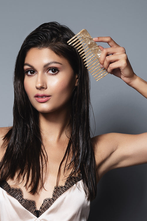 model using the hair edit untangle and glide beige comb in wet hair