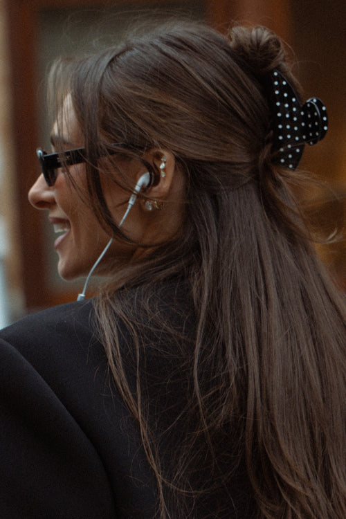 Danielle Bernstein wearing The Hair Edit’s black polka dot claw clip in her hair