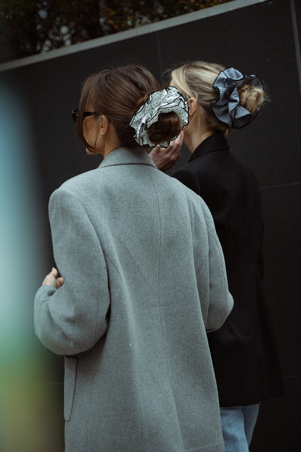 Danielle Bernstein wearing The Hair Edit’s White and black polka dot oversized scrunchie in the streets of nyc3