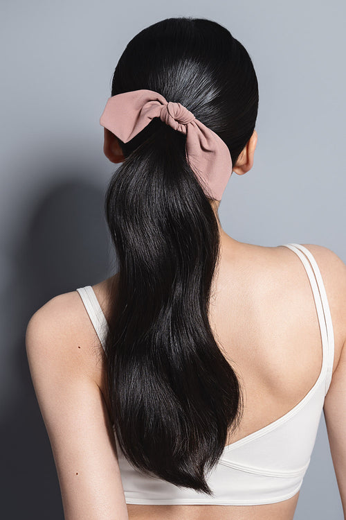 model with Bow Pose Knotted Ribbon Scrunchie in her hair 