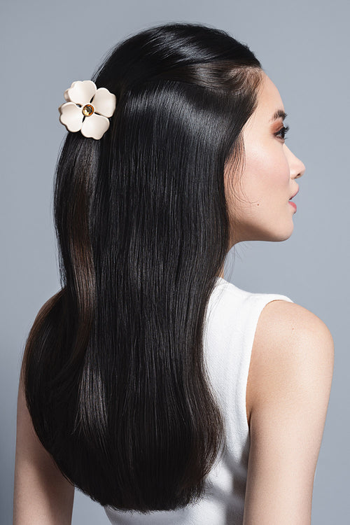 model with Camellia Rhinestone Flower Claw Clip in her hair 