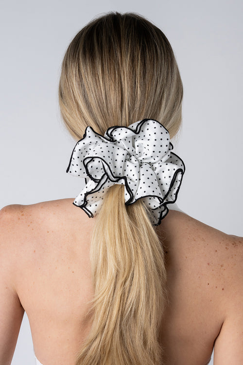 Blonde model wearing White and black polka dot oversized scrunchie 