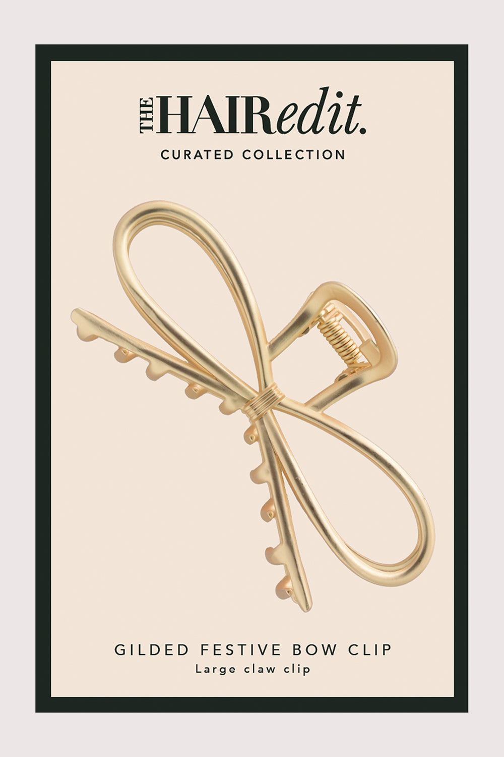 Gilded festive bow clip packaging with 'The Hair Edit' branding5