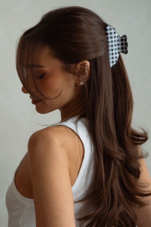 Danielle Bernstein wearing The Hair Edit’s Black and white gingham scalloped claw clip in her hair