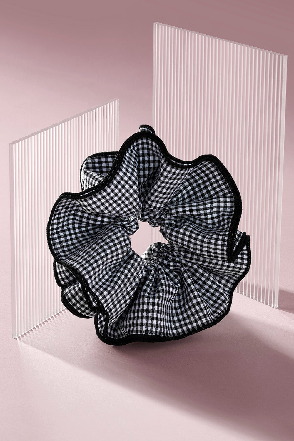 Black and white gingham oversized ruffled scrunchie on a pink background7