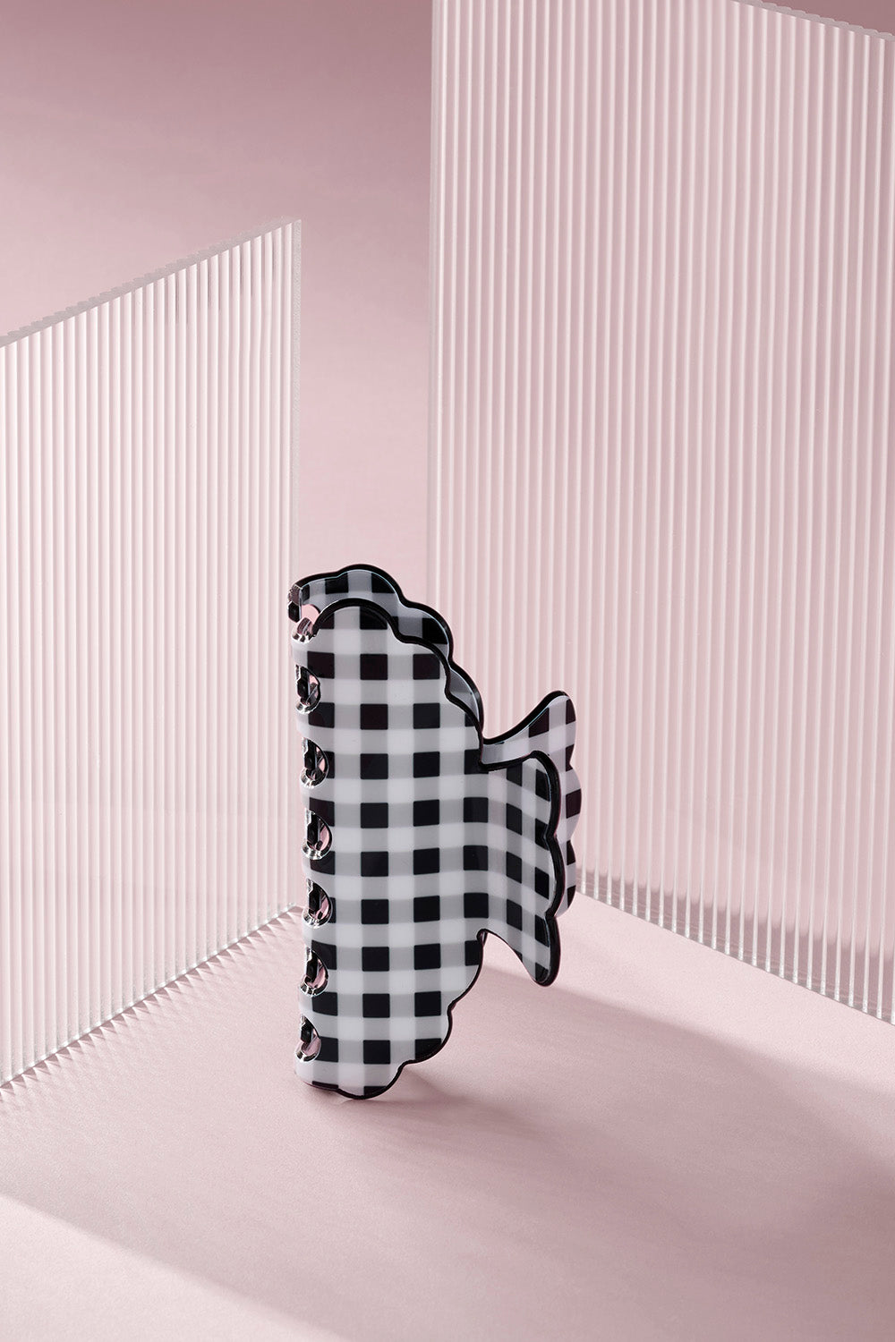 Black and white gingham scalloped claw clip on a pink background8