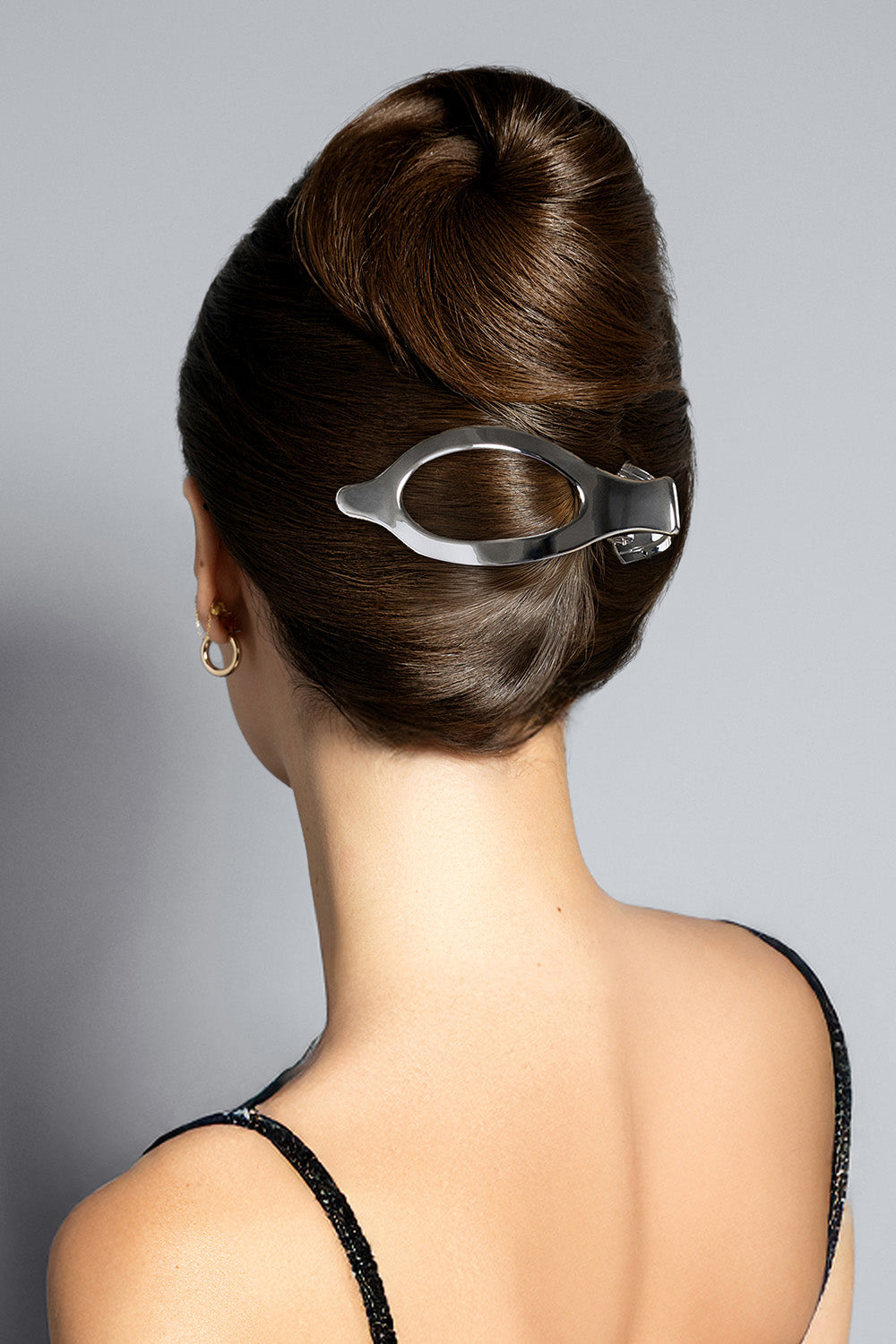 Brunette model wearing The Hair Edit’s Silver Flat Lay Claw Clip in her hair as a French twist7