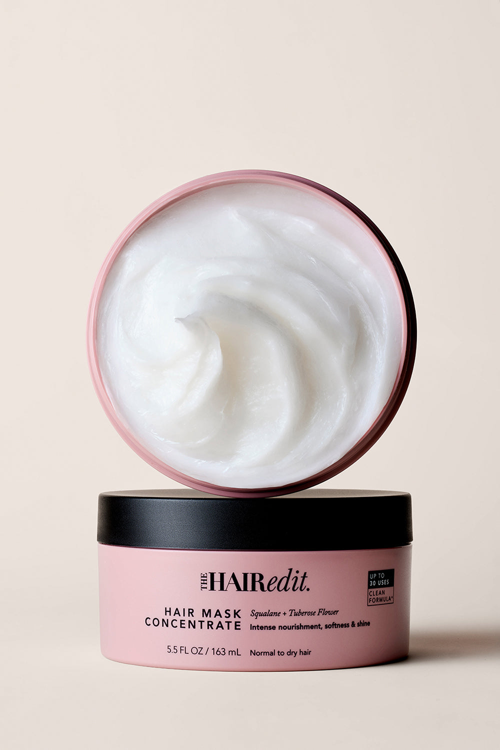 Image of an open jar of The Hair Edit Hair Mask Concentrate on a Beige Background 11