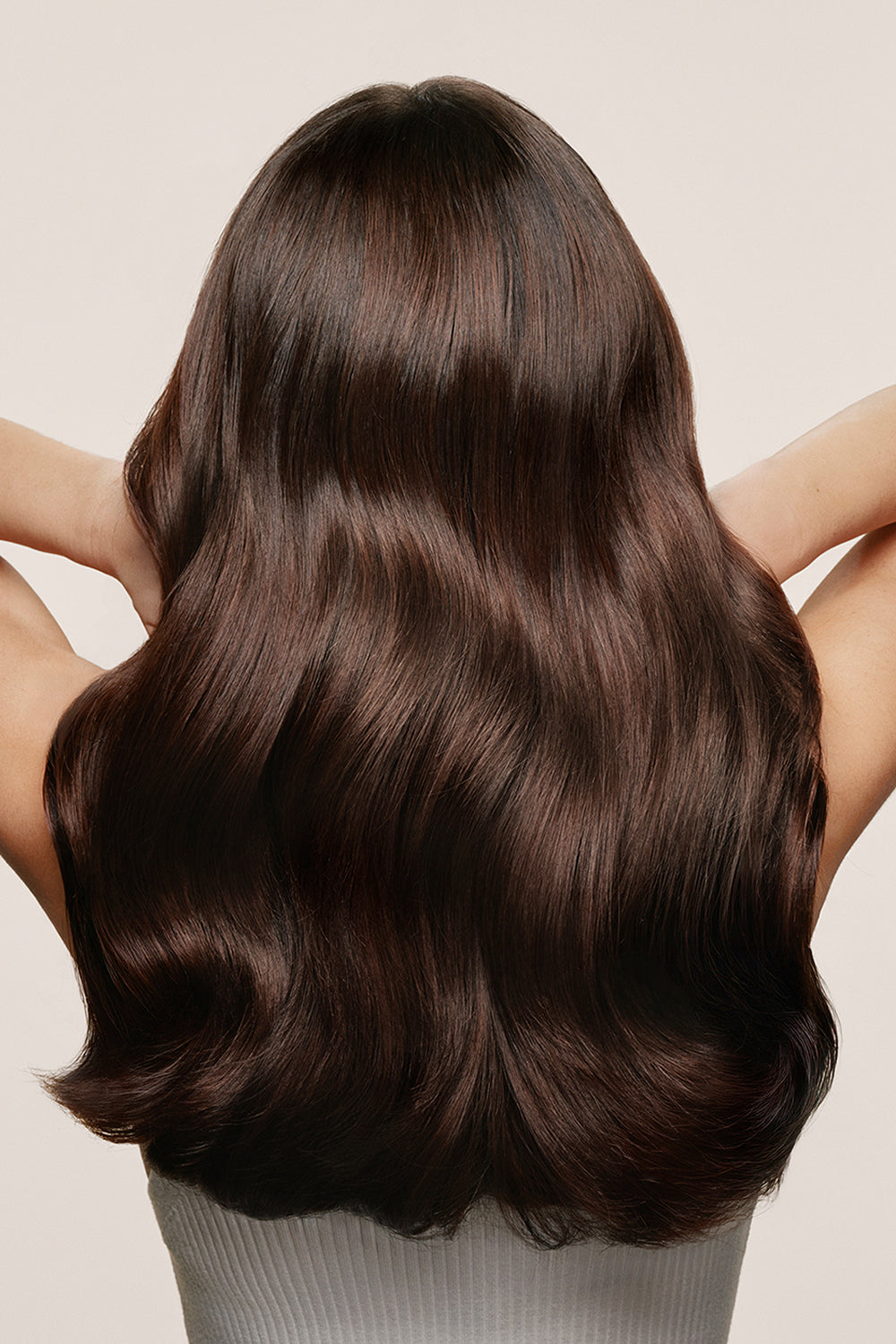 Model with Long, wavy brown hair on a neutral background5