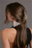 A video of a brunette model wearing The Hair Edit Gilded Timeless Clip